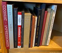 Shelf containing vintage photography and art books, showing spines and titles