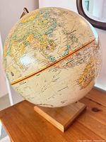 Full view of the Globemaster desk globe on wood base