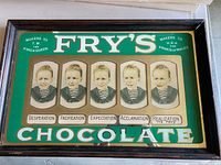 Full view of Fry's Five Boys advertising mirror showing portraits, text, and wood frame