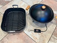 Electric Maxim wok with lid, probe and All-Clad roasting pan with rack on tiled floor