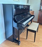 Full view of Yamaha U3 upright piano with bench