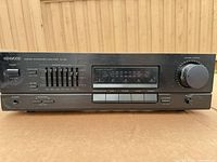 Front view showing model, controls, and cosmetic wear