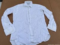 Single white dress shirt laid out