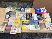 All 27 books laid out on table – full lot view