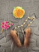 Front view showing yellow rose brooch, pink blossom brooch and mink fur sweater clips