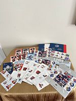 Overview of all stamp sheets and booklets spread on table