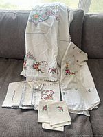 All linens together on sofa showing both tablecloths and napkins