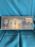 Box lid showing branding and glass images