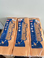 Front view of three sealed Magicloth packages