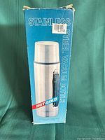 Front of retail box showing product image and stainless steel vacuum bottle labeling