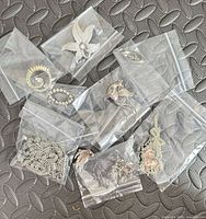 Group view of all jewellery items in individual bags