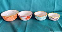 Four Pioneer Woman ceramic measuring bowls full set