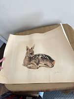 Full view of unframed signed etching showing resting fawn on aged paper
