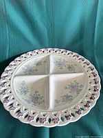 Top view showing four divisions, floral pattern and pierced bow rim