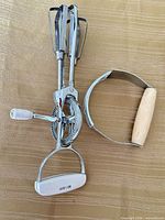 Front view of rotary egg beater and pastry blender together