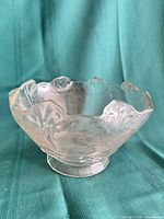 angled view showing scalloped rim and pattern