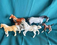 Group shot of all six porcelain horse figurines