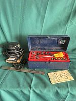 All items grouped: palm sander, socket set closed, combo square, metric card