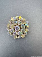 Front view showing cluster of iridescent rhinestones