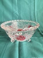 Side view showing Satin Rose design and footed base