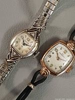 Both watches side by side showing overall design and condition