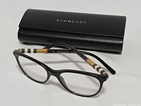 Full view of eyeglasses and Burberry case