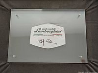 Front view of Lamborghini engine plate on foam backing