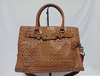 Front view of Michael Kors Hamilton grommet satchel