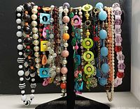 All necklaces displayed on stand