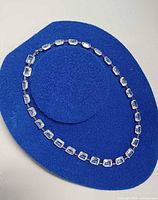 Necklace laid out in oval shape showing full length and crystal arrangement