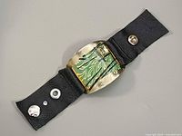 Full bracelet opened showing buckle and snaps