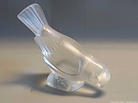 Front angled view of frosted crystal sparrow figurine
