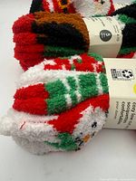 Close-up of bundled socks showing plush texture and holiday patterns