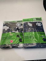 Front view of both packaged shirts