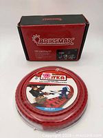 Briksmax LED Lighting Kit box beside sealed red brick tape roll