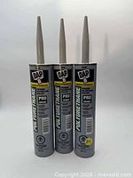 Front view of three DAP polyurethane sealant tubes