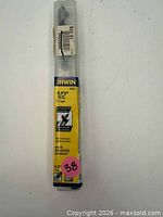 Front view of sealed IRWIN auger bit in tube with size and price sticker