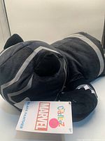 Front view of Black Panther plush showing face, suit detailing and hangtag