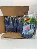 Open carton showing multiple sealed Scotch-Brite refill pads