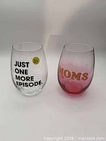 Both stemless wine glasses side by side