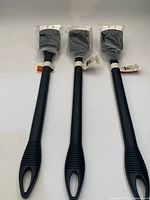 Front view of three new grill brushes