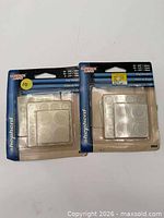 Front view of both unopened Shepherd Surface Gard bumper packs