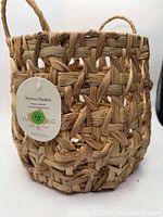 Front view of basket showing weave, tag and handle