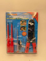 Full package front showing all four tools and branding