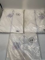 Three sealed packages showing L/G size marking