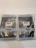 Front view of two sealed packs showing ‘Popular’ branding and barcode label