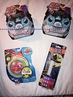 Front view showing all four sealed items: two Cubbo packs, one B3 Booster, one PEZ dispenser