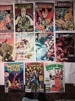 Group shot of all 11 DC comics laid out in three rows