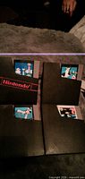 Four NES cartridges partially in dust sleeves