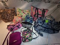 Group image of all 10 Vera Bradley bags arranged together